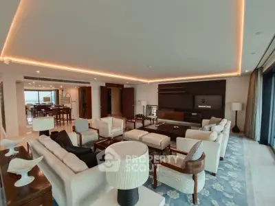 Luxurious and spacious living room with elegant furniture and ambient lighting, perfect for entertaining.