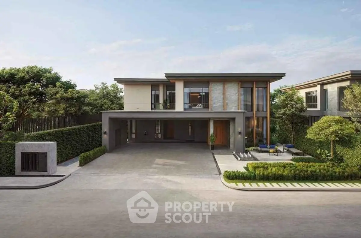 Modern luxury home exterior with spacious driveway and lush landscaping