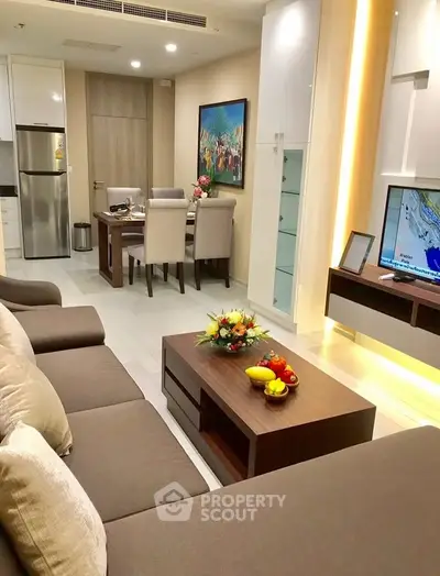 Modern living room with elegant dining area and stylish decor in a contemporary apartment.