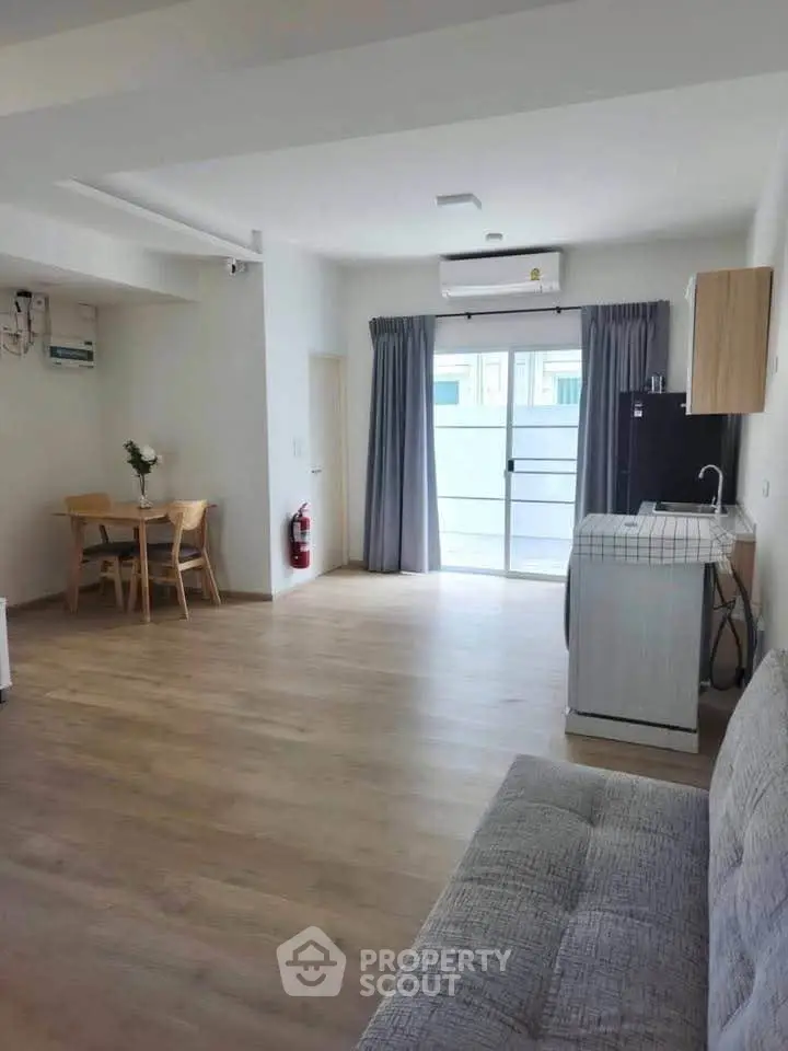 Spacious living room with modern decor and natural light