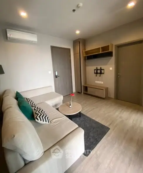 Modern living room with stylish furniture and air conditioning