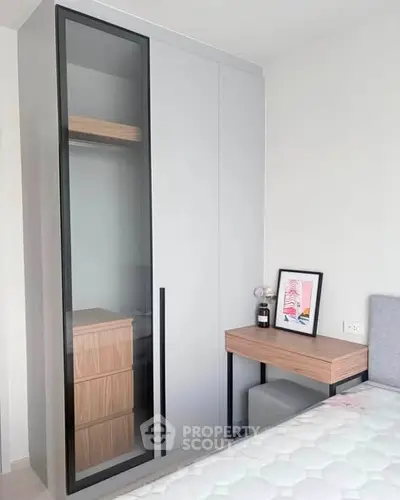 Modern bedroom with sleek wardrobe and stylish decor