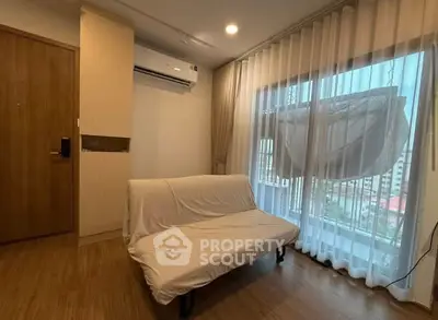 Cozy living room with modern air conditioning and large window view.