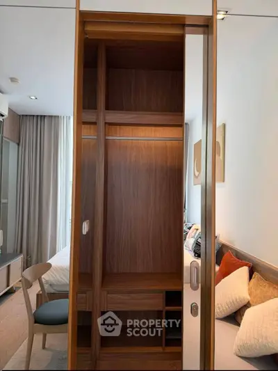 Modern bedroom with built-in wooden wardrobe and cozy decor