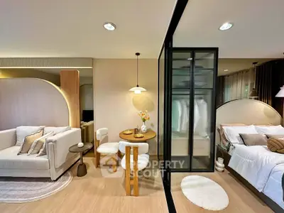 Modern open-plan living room and bedroom with stylish decor and cozy ambiance