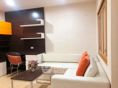 Modern living room with white sectional sofa and stylish decor