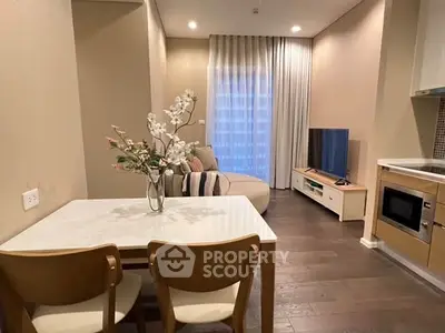 Modern living room with elegant decor and open kitchen layout