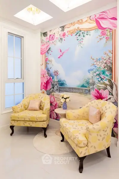 Elegant living room with floral mural and yellow armchairs, perfect for relaxation.