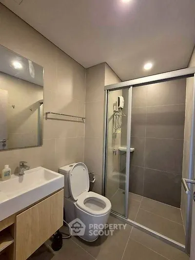 Modern bathroom with sleek design and glass shower enclosure