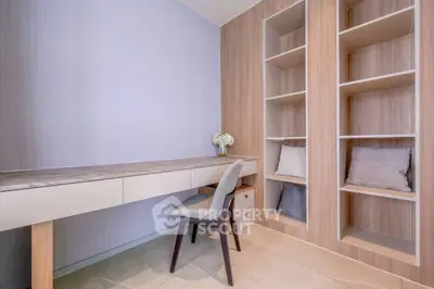 Modern study room with built-in shelves and sleek desk design