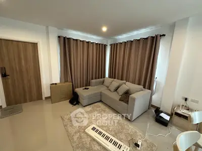 Modern living room with cozy sectional sofa and stylish curtains