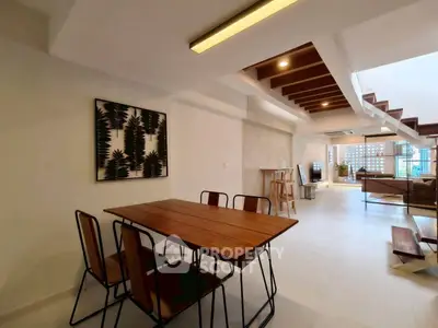 Spacious modern living room with dining area and stylish decor