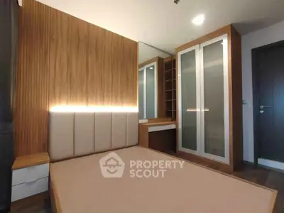 Modern bedroom with wooden accents and built-in wardrobe