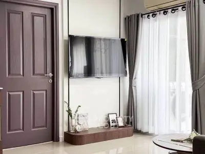 Modern living room with wall-mounted TV and elegant decor