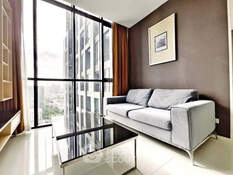 Modern living room with floor-to-ceiling windows and city view