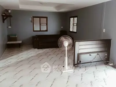 Spacious living room with modern flooring and minimalist decor