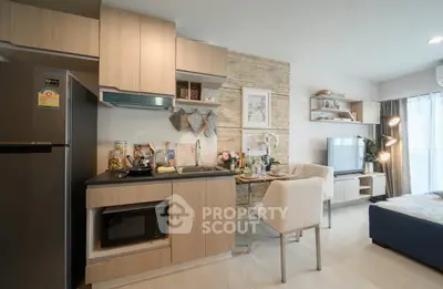 Modern kitchen and living area with stylish decor and open layout in a contemporary apartment.