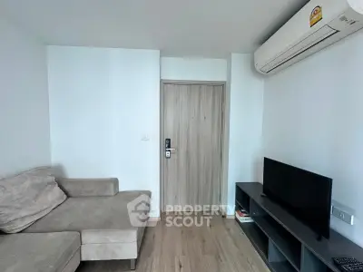 Modern living room with sleek furniture and air conditioning