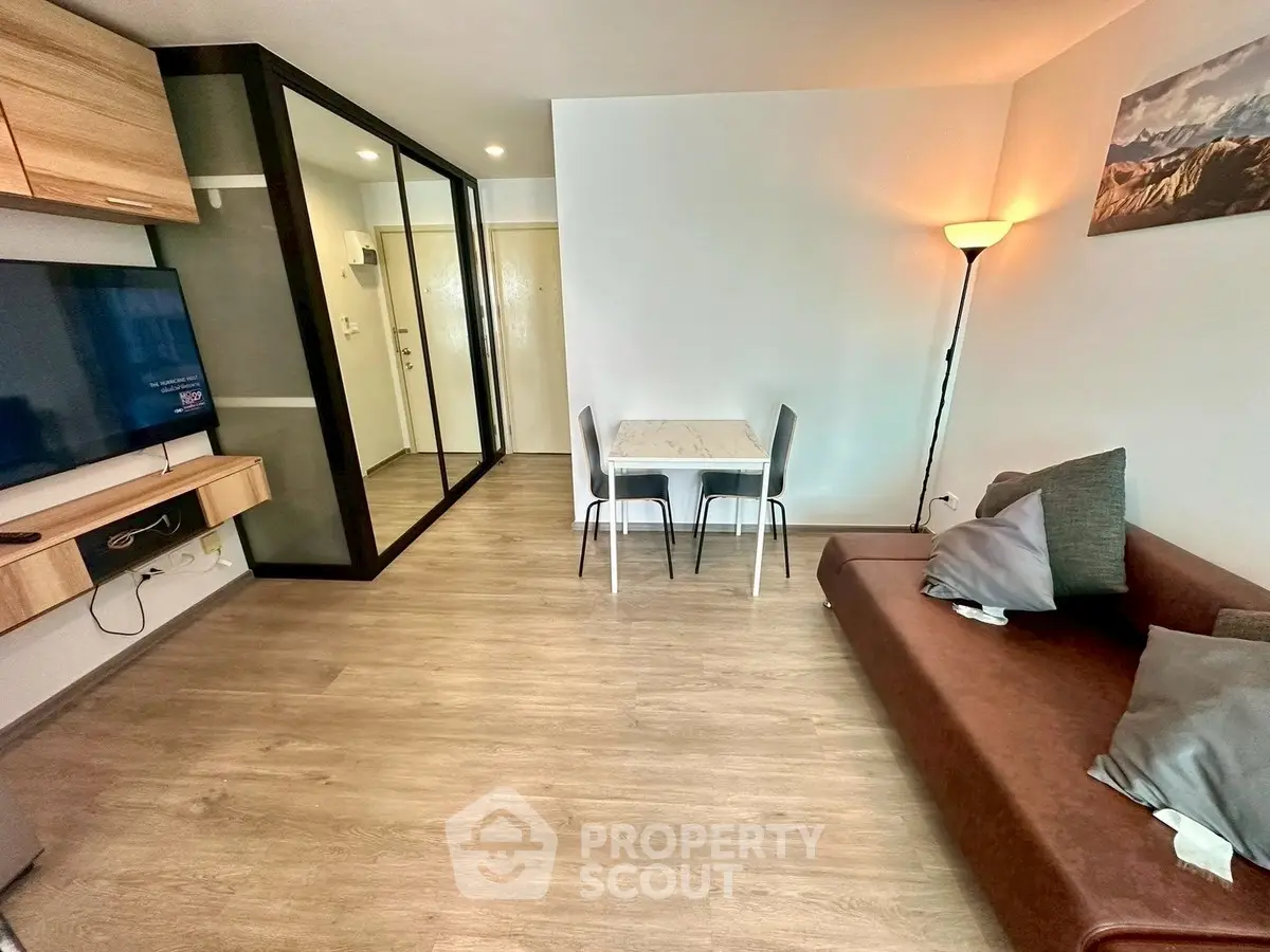 Modern living room with sleek furniture and wooden flooring