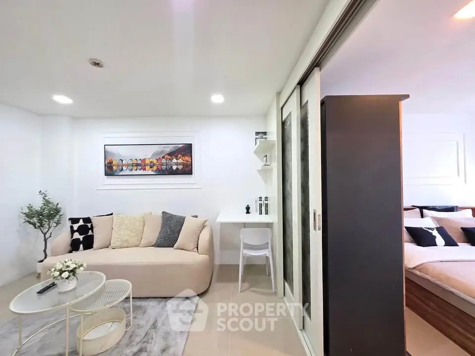 Modern living room with cozy sofa and stylish decor in open layout apartment