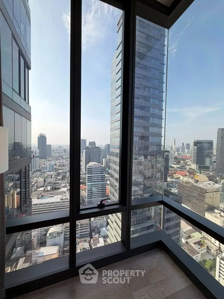 Stunning corner unit with floor-to-ceiling windows offering breathtaking city views in a modern high-rise building.