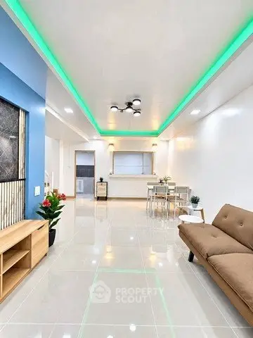 Modern living room with sleek design and ambient lighting