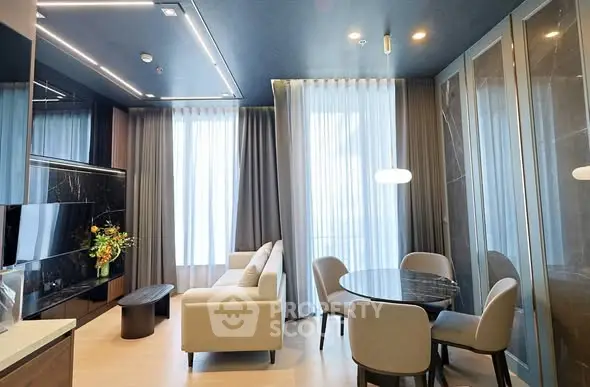 Modern living room with elegant decor and large windows