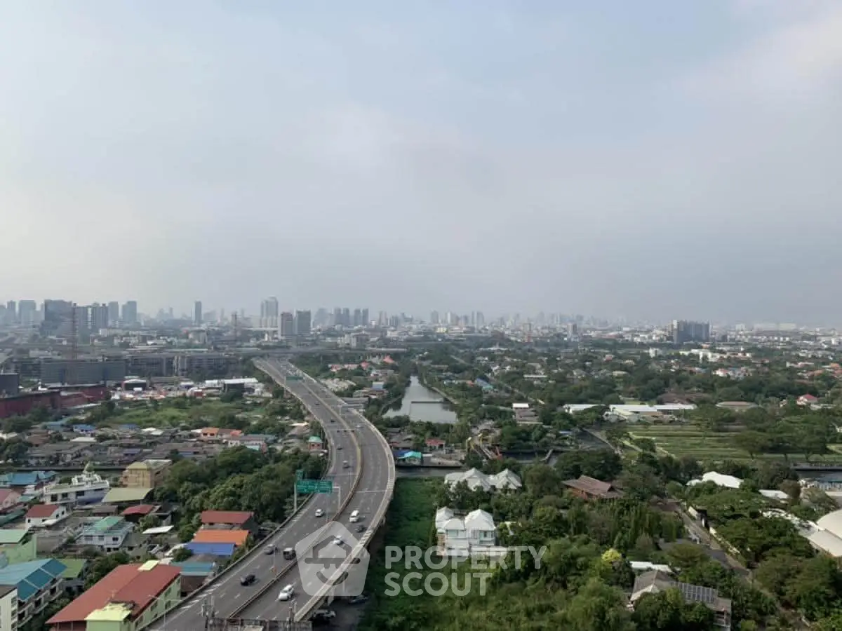 Stunning cityscape view showcasing urban skyline and highway, ideal for real estate investment opportunities.