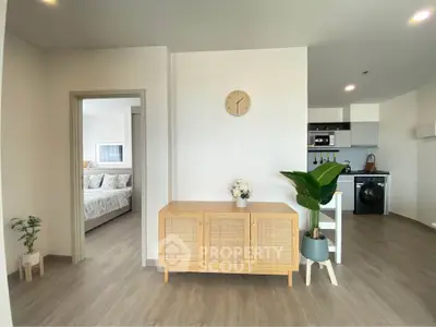 Modern open-plan living space with stylish decor and natural light