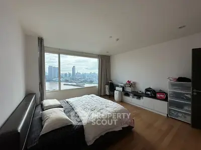 Spacious bedroom with stunning city view and modern furnishings