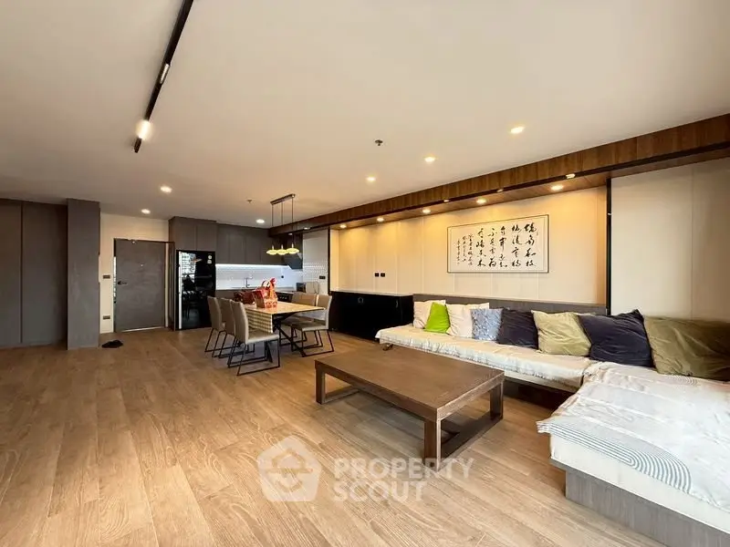 Spacious modern living room with open kitchen and stylish decor