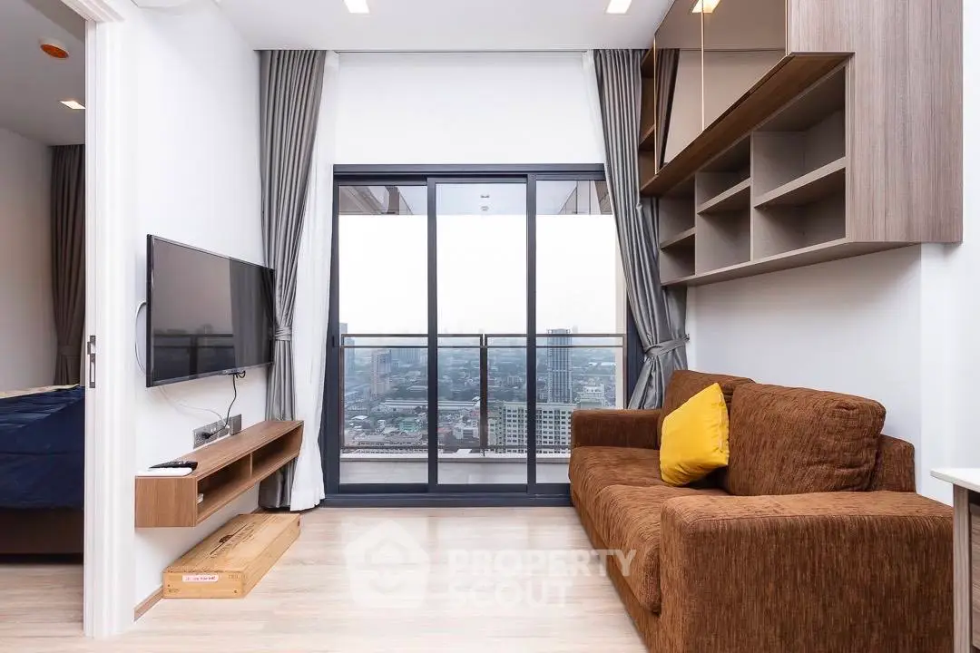 Modern living room with city view, featuring a cozy brown sofa and sleek wall-mounted TV.