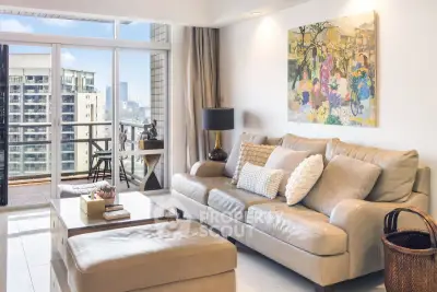 Spacious living room with elegant decor and balcony view in modern apartment