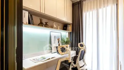 Modern study room with sleek desk, chairs, and ample natural light from large window.