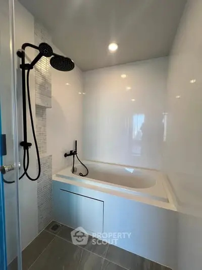 Modern bathroom with sleek bathtub and rainfall showerhead