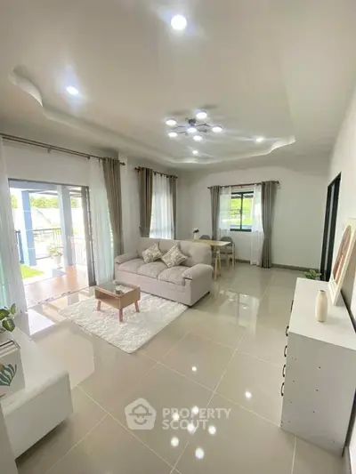 Spacious modern living room with elegant decor and natural light