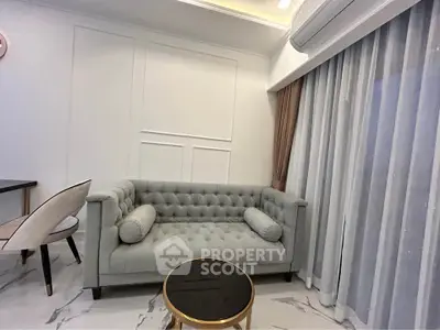 Elegant living room with tufted sofa and modern decor