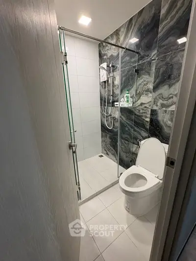 Modern bathroom with sleek design and glass shower enclosure