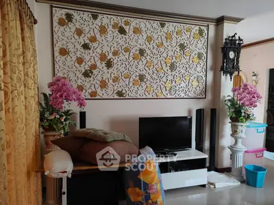 Charming living room with elegant decor and vibrant floral arrangements