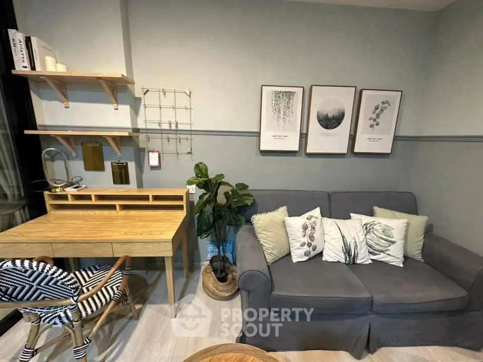 Chic living room with cozy sofa and stylish decor in modern apartment.