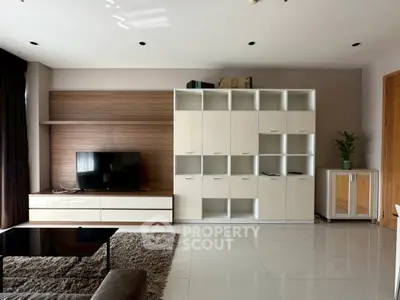 Modern living room with sleek storage units and a flat-screen TV, perfect for stylish urban living.