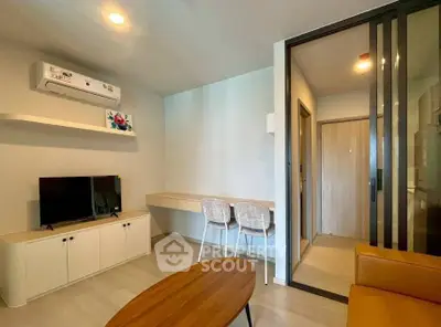 Modern living room with sleek furniture and air conditioning in a stylish apartment.