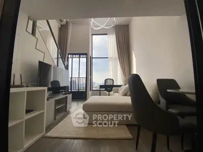 Modern living room with high ceiling and large windows offering city views