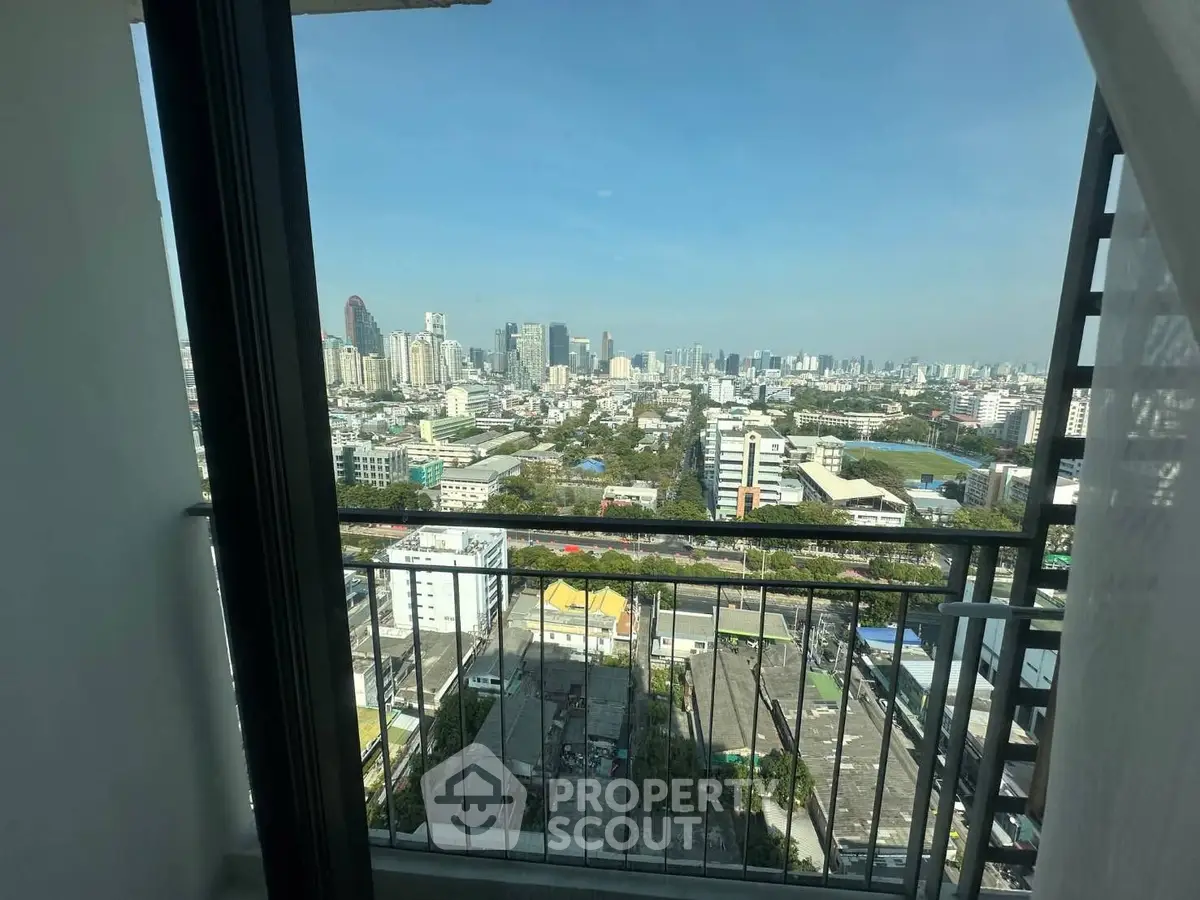 Stunning cityscape view from a high-rise balcony, perfect for urban living enthusiasts.