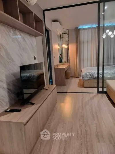 Modern bedroom with sliding glass doors and stylish decor