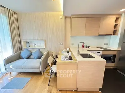 Modern open-layout kitchen and cozy living area with natural light