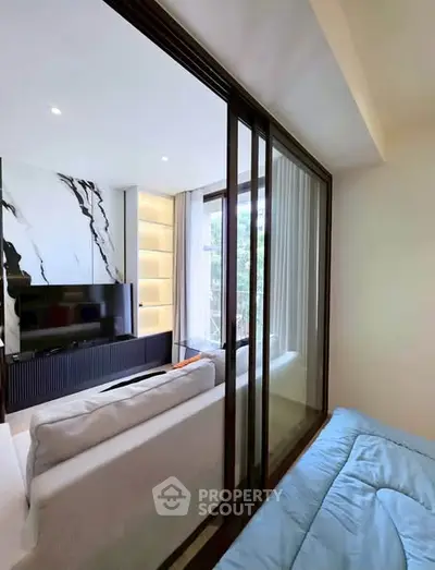 Modern living room with stylish decor and large windows for natural light