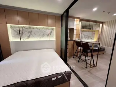 Modern bedroom with stylish decor and cozy ambiance, featuring a comfortable bed and elegant lighting.