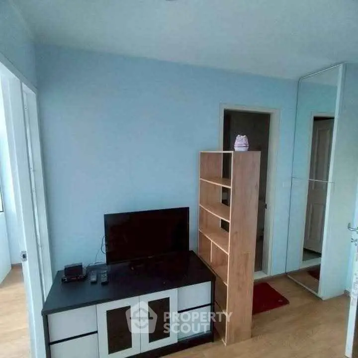 Cozy living room with modern TV stand and wooden shelving unit