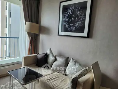 Stylish living room with modern sofa, elegant decor, and balcony view